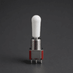 White silicone switch cap installed on a toggle switch