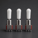 Multiple toggle switches fitted with white silicone caps